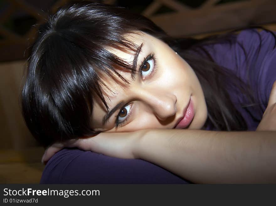 Girl portrait. Laying on the table