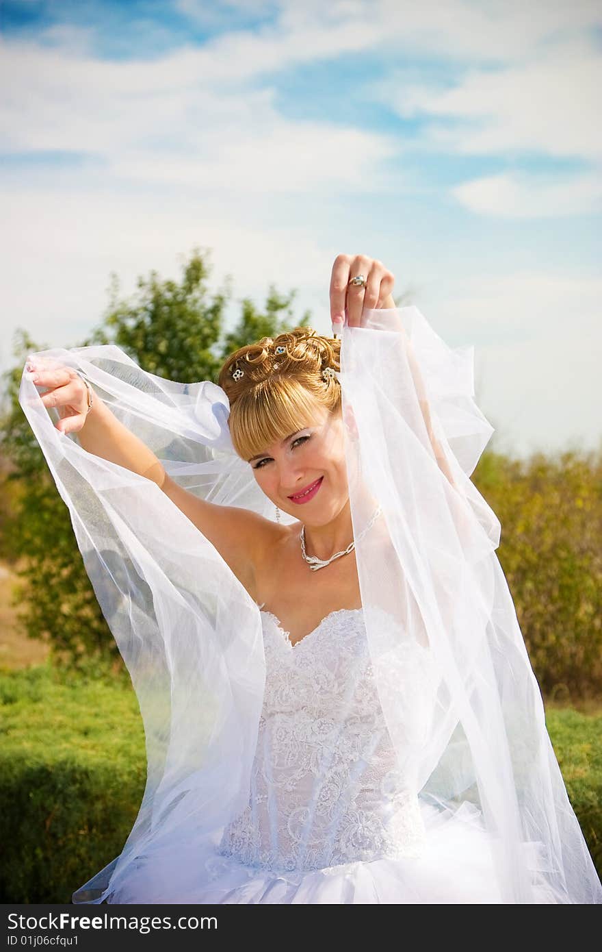 Joy pretty bride in the park