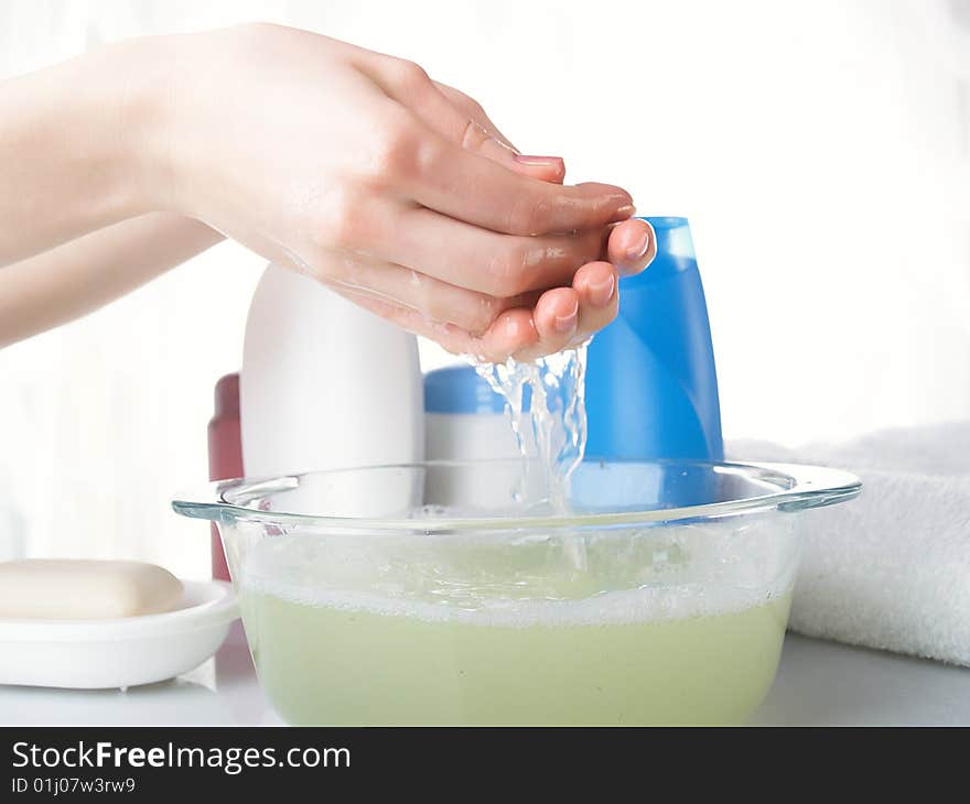 Foam of soap and female hands. Foam of soap and female hands