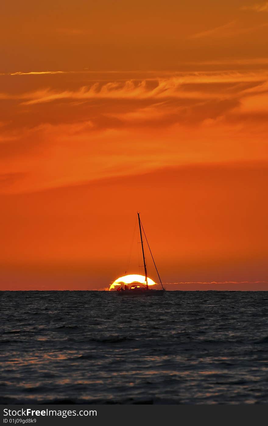 Sunset and silhouette of sailing boat. Sunset and silhouette of sailing boat