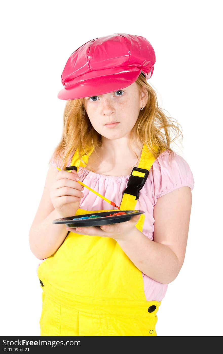 Little girl is painting on a white paper isolated