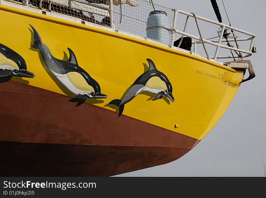 Bow Of Yacht With Painted Dolphins