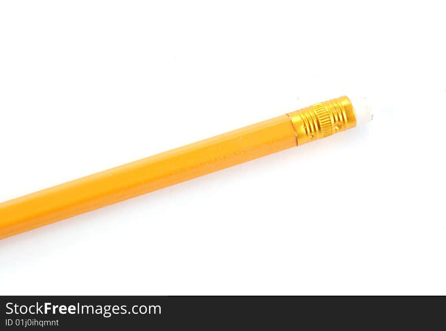 The yellow pencil on a white background