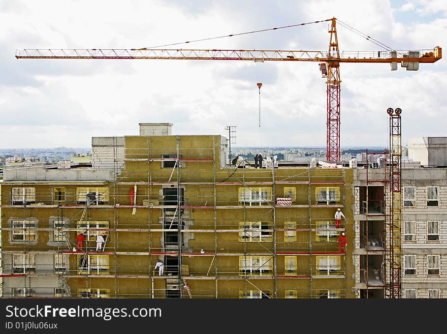 New construction with workers on scaffoldings