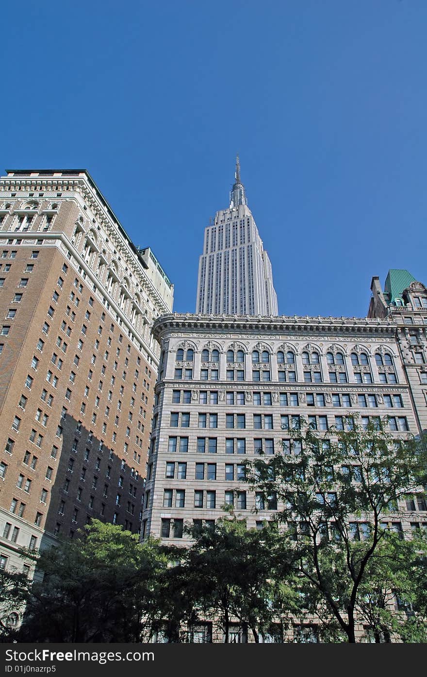 View of the Empire and adjacent buildings from a street in Manhattan. View of the Empire and adjacent buildings from a street in Manhattan