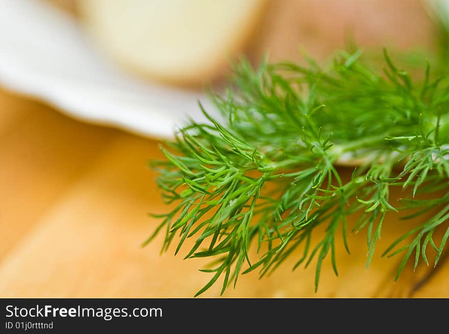 Potatoes, salt cucumber and dill still-life.