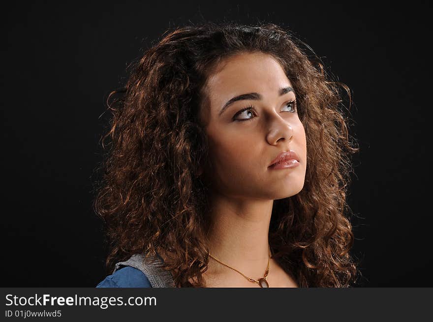 Young beautiful woman's portrait
over black