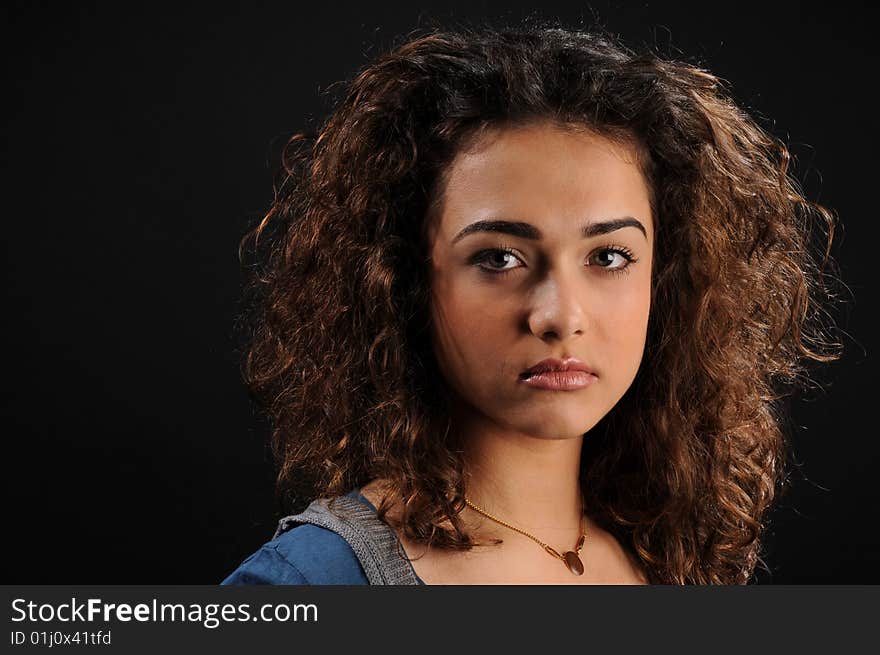 Young beautiful woman's portrait
over black