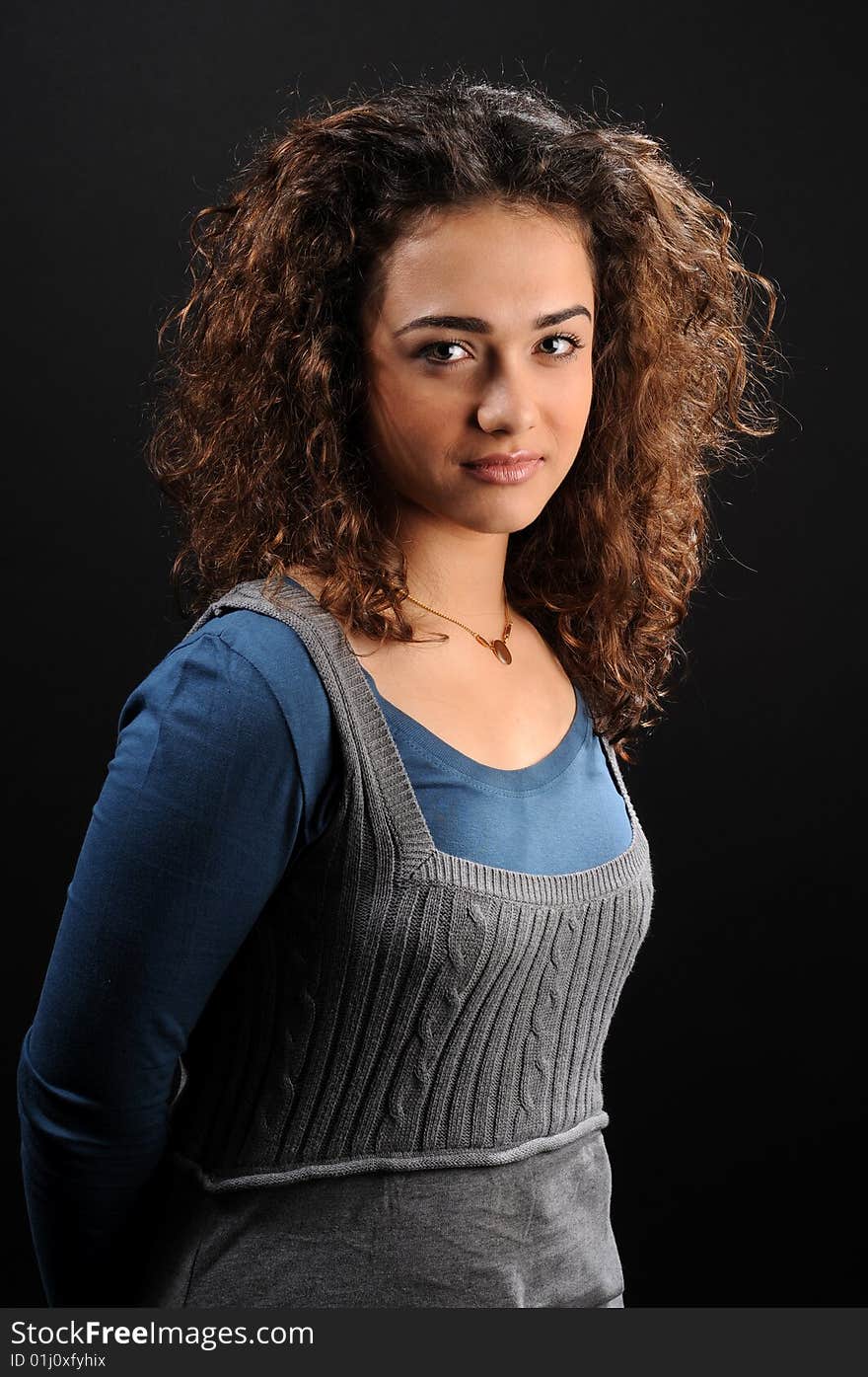 Beautiful model with curly hair over black