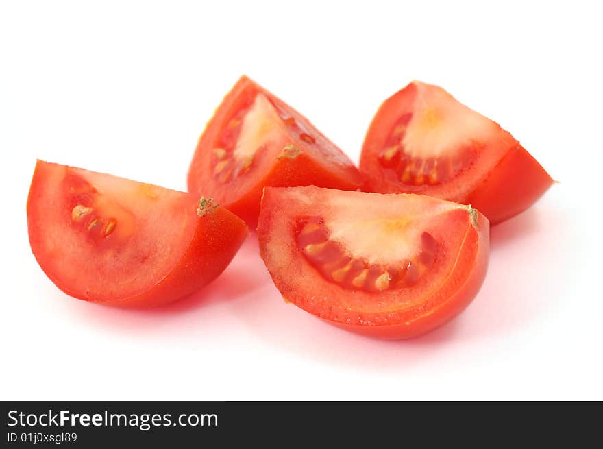 Isolated tomato slices on white background