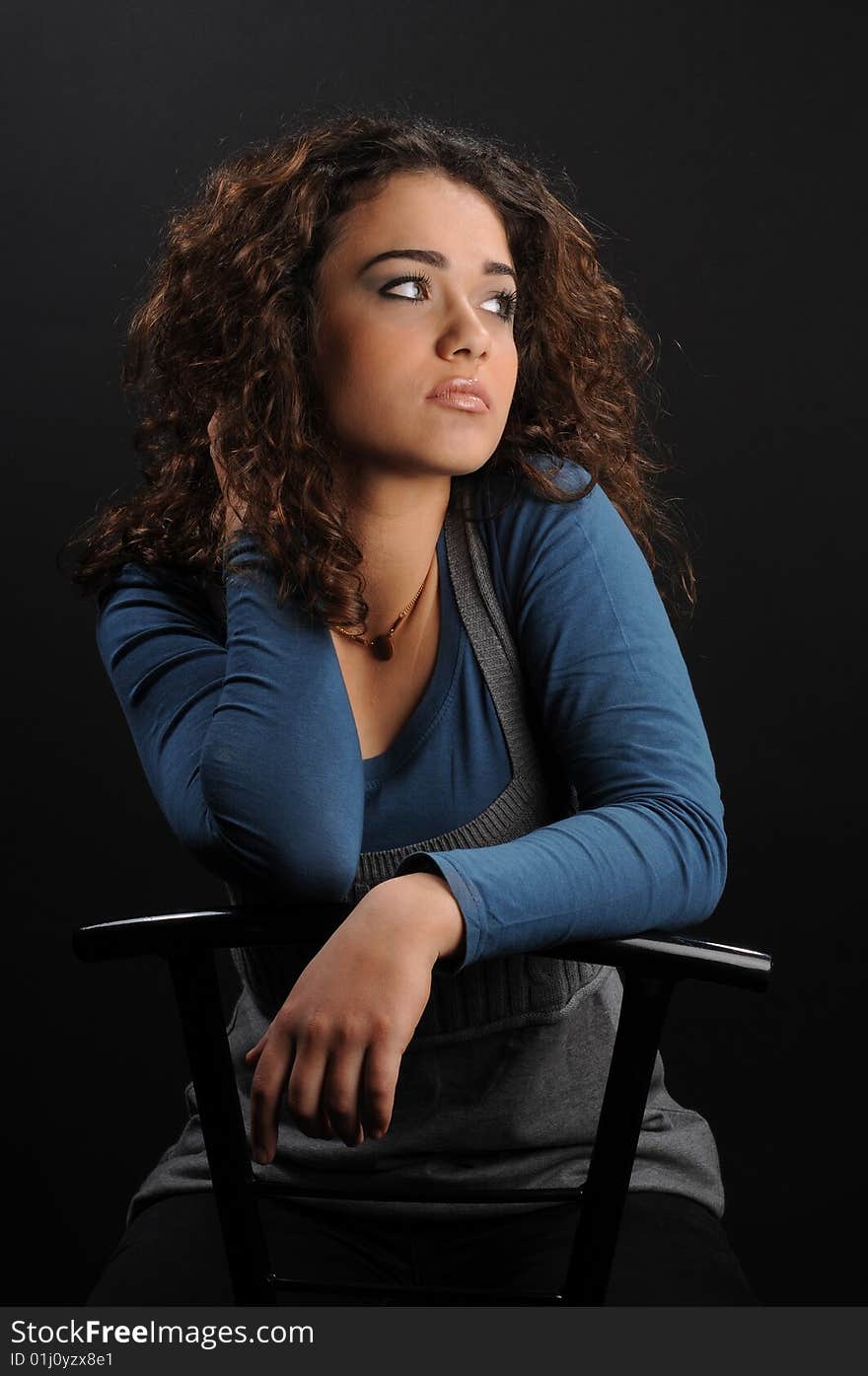 Beautiful model with curly hair over black