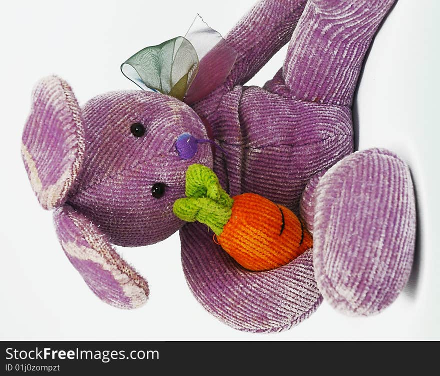 Tired and worn purple toy bunny. Tired and worn purple toy bunny