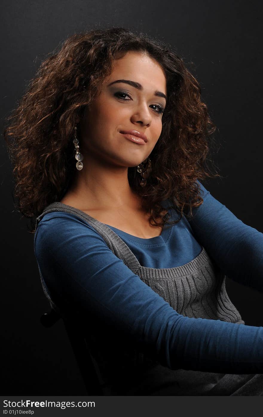 Beautiful model with curly hair over black