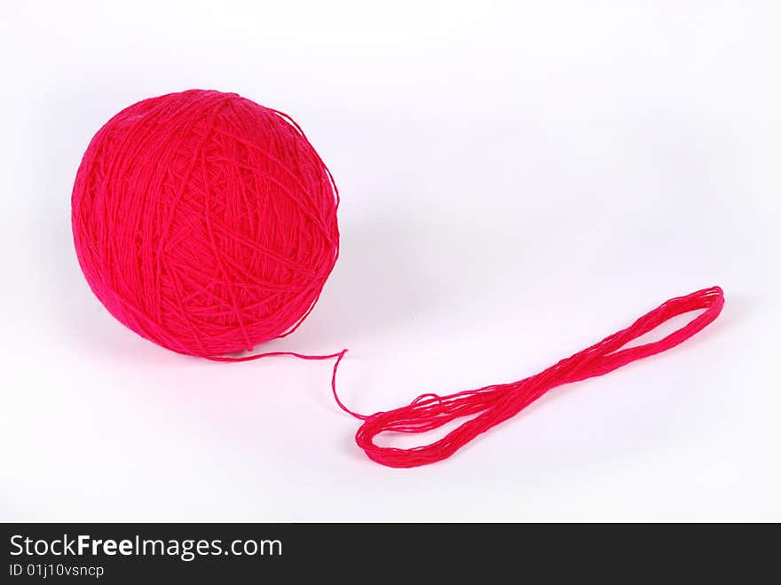 Red threads and clew  isolated on a white background. Red threads and clew  isolated on a white background