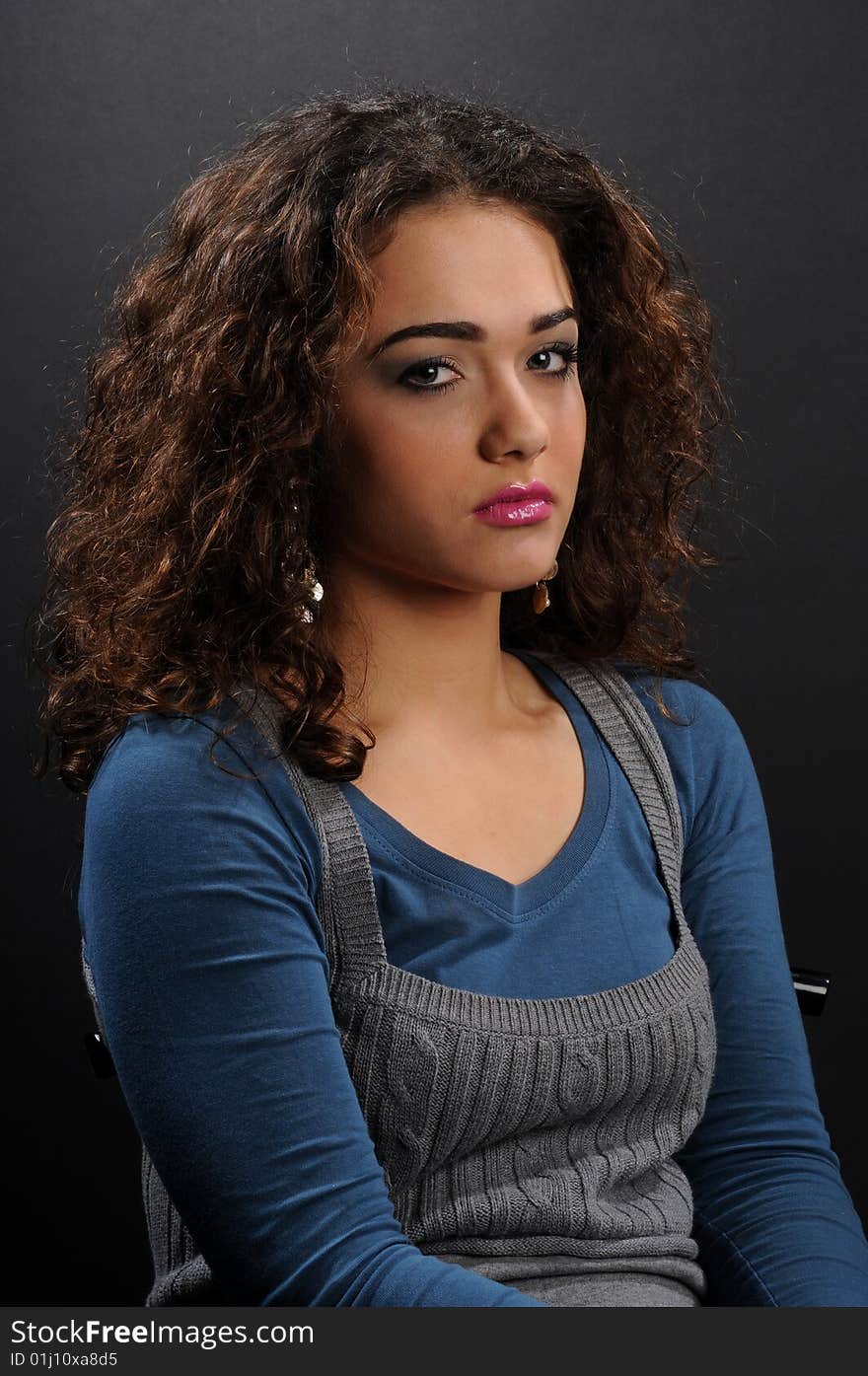 Beautiful model with curly hair over black