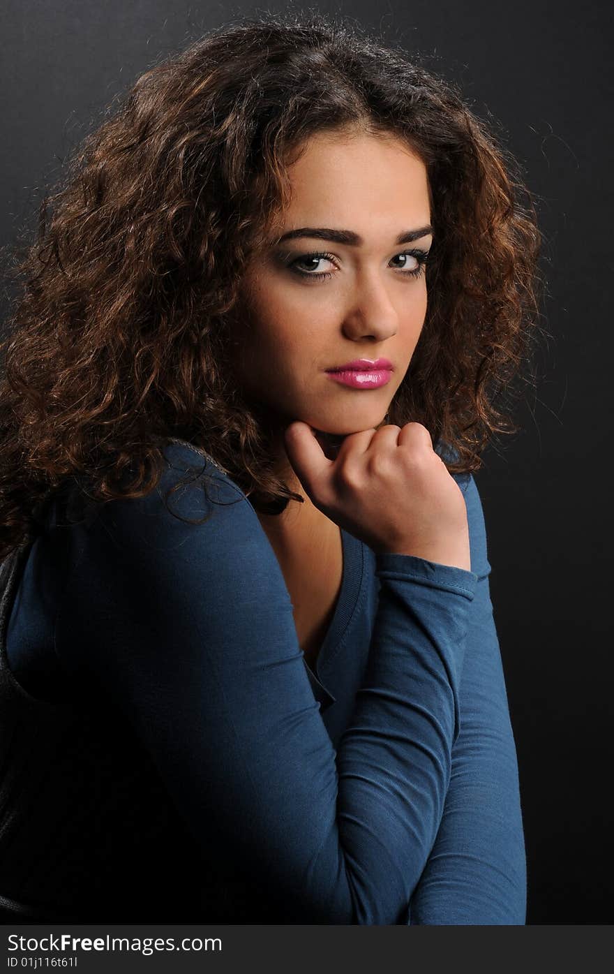 Beautiful model with curly hair over black