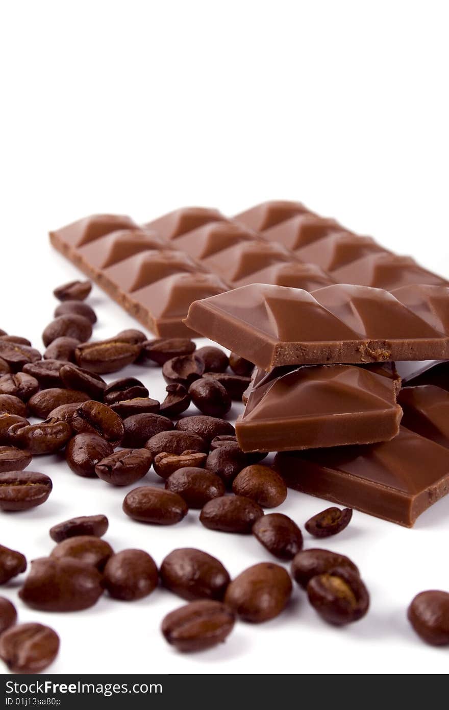 Chocolate and coffee beans on white background