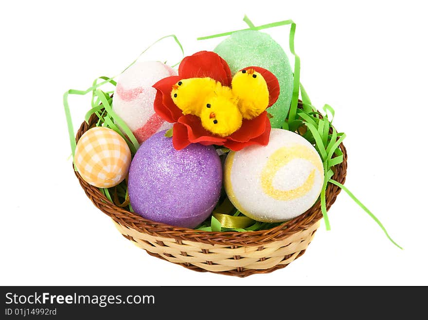 Easter basket with eggs and little chicken in a flower isolated on white background,check also Flowers. Easter basket with eggs and little chicken in a flower isolated on white background,check also Flowers