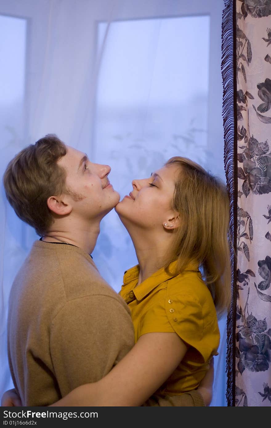 Happy young couple is happy. The girl and the young man are smiling. Happy young couple is happy. The girl and the young man are smiling.