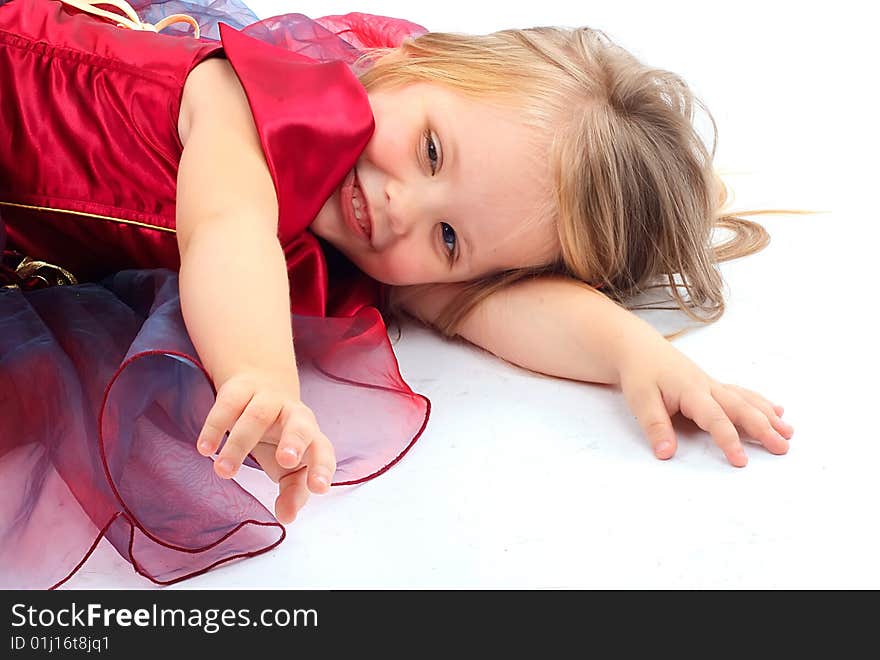 Portrait of the beautiful girl in a red dress