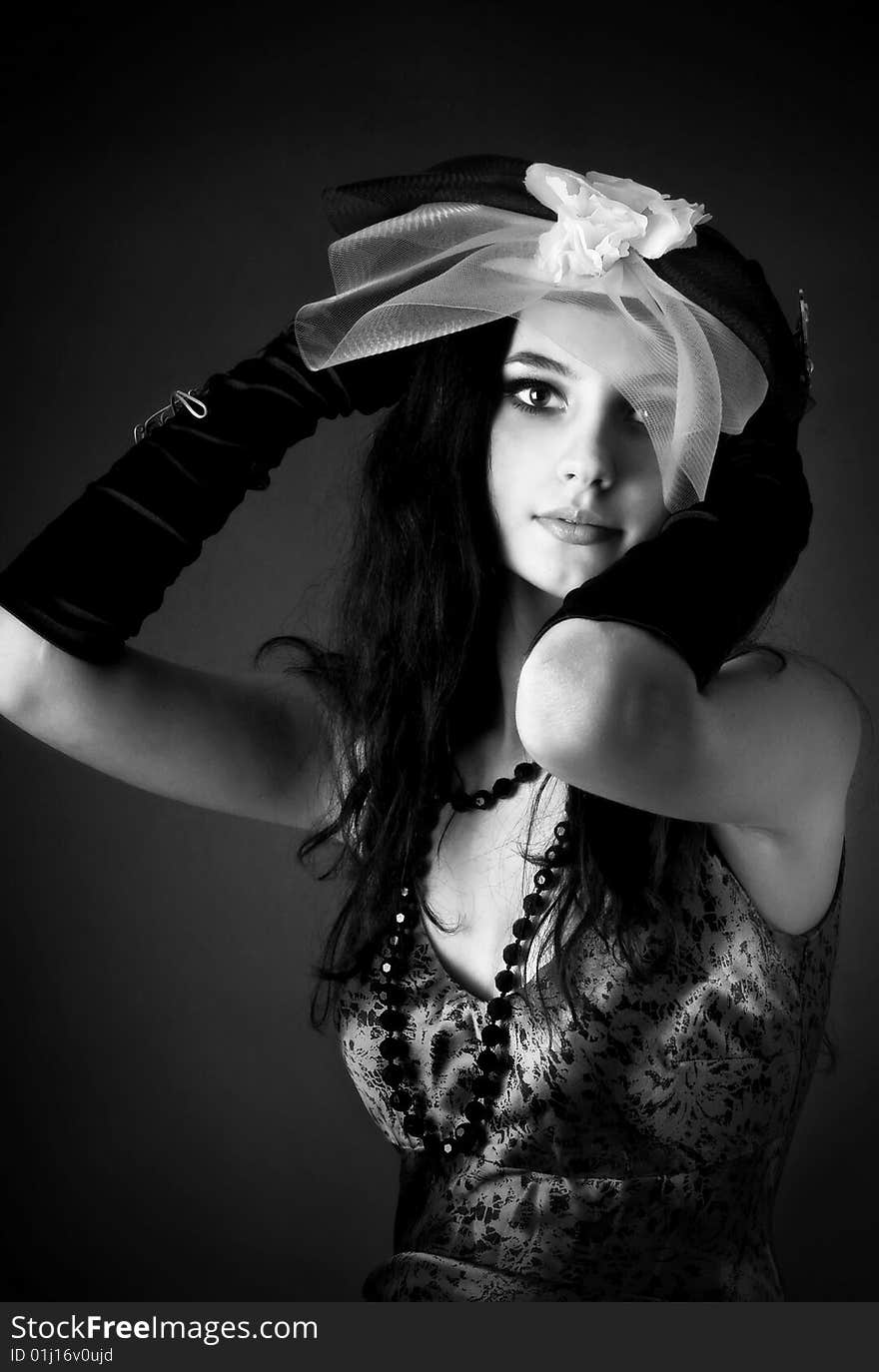 Series. Portrait of the beautiful brunette in a dark blue dress