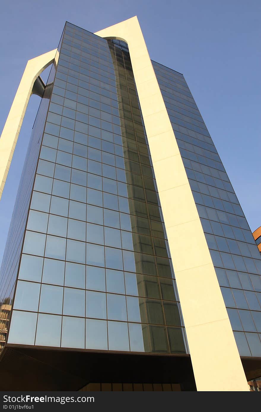 A modern building made of glass in Sesto San Giovanni, Italy. A modern building made of glass in Sesto San Giovanni, Italy