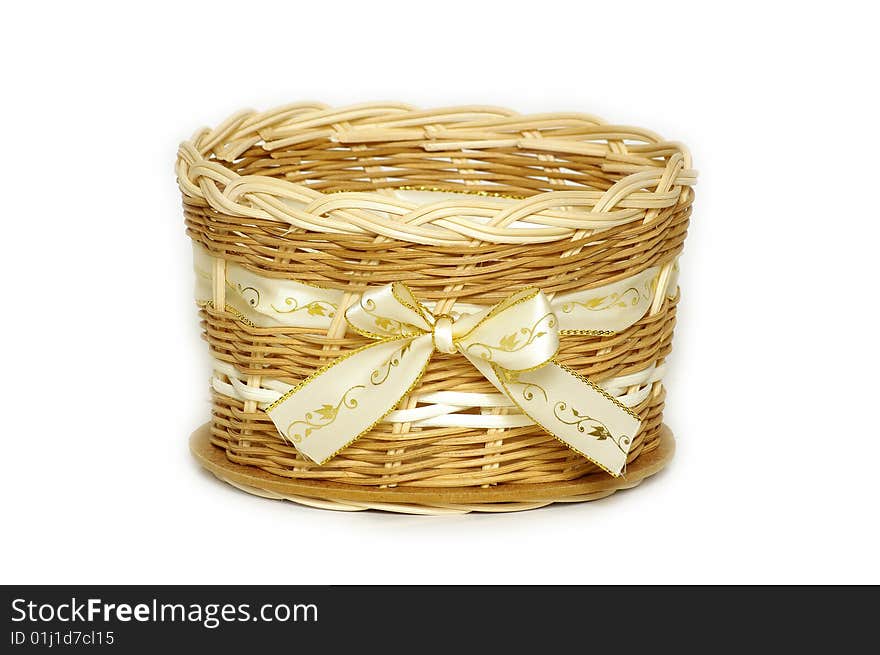 A wicker basket with textile bow home decoration