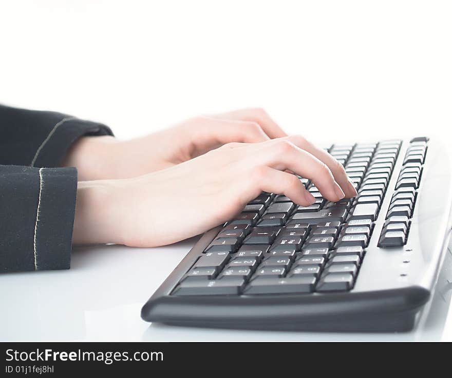 Girl hands typing on the background. Girl hands typing on the background