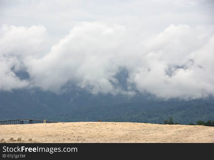 Langkawi beach and clouds on mountains