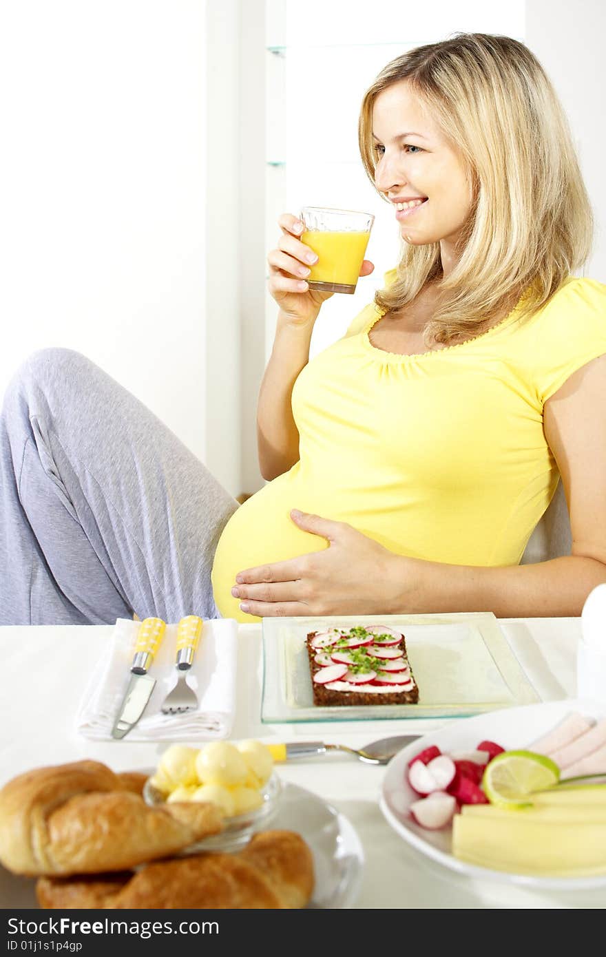 Pregnant Woman Is Drinking Orange Juice