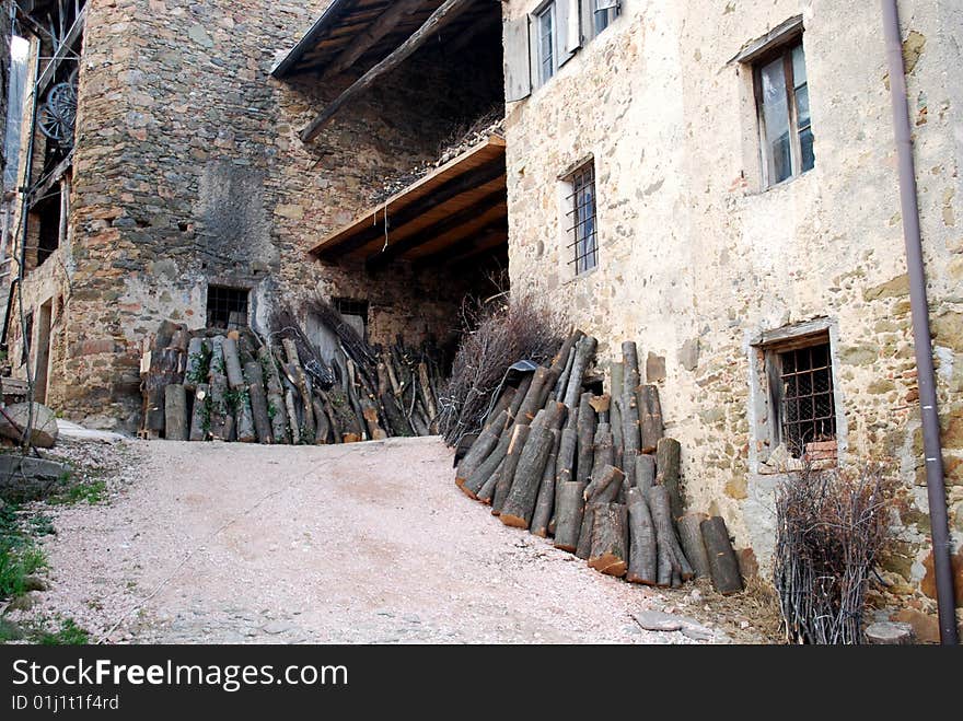 Old and ancient farm and Stacked logs s. Old and ancient farm and Stacked logs s