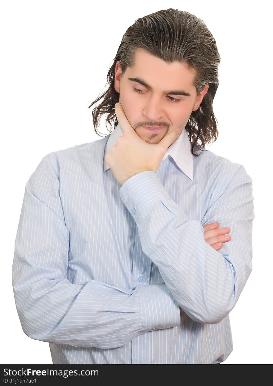 Young worried dark haired businessman in light blue striped shirt holds hand on his chin isolated on white. Young worried dark haired businessman in light blue striped shirt holds hand on his chin isolated on white