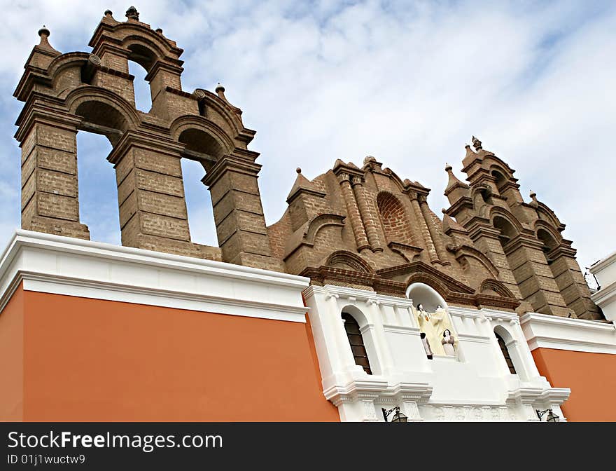 A strange building ediface shows layers of history in Trujillo, Peru. A strange building ediface shows layers of history in Trujillo, Peru