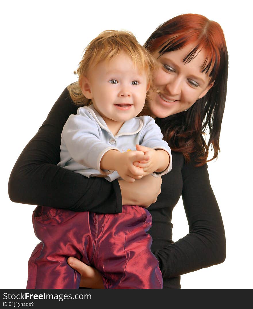 Mother holding a child who looks very happy