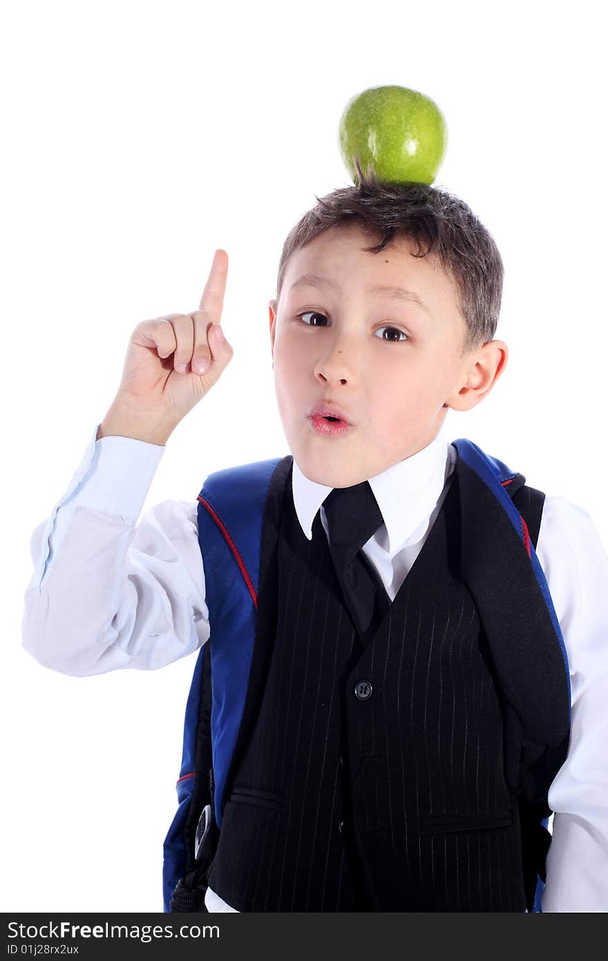 Schoolboy with backpack and apple isolated on white