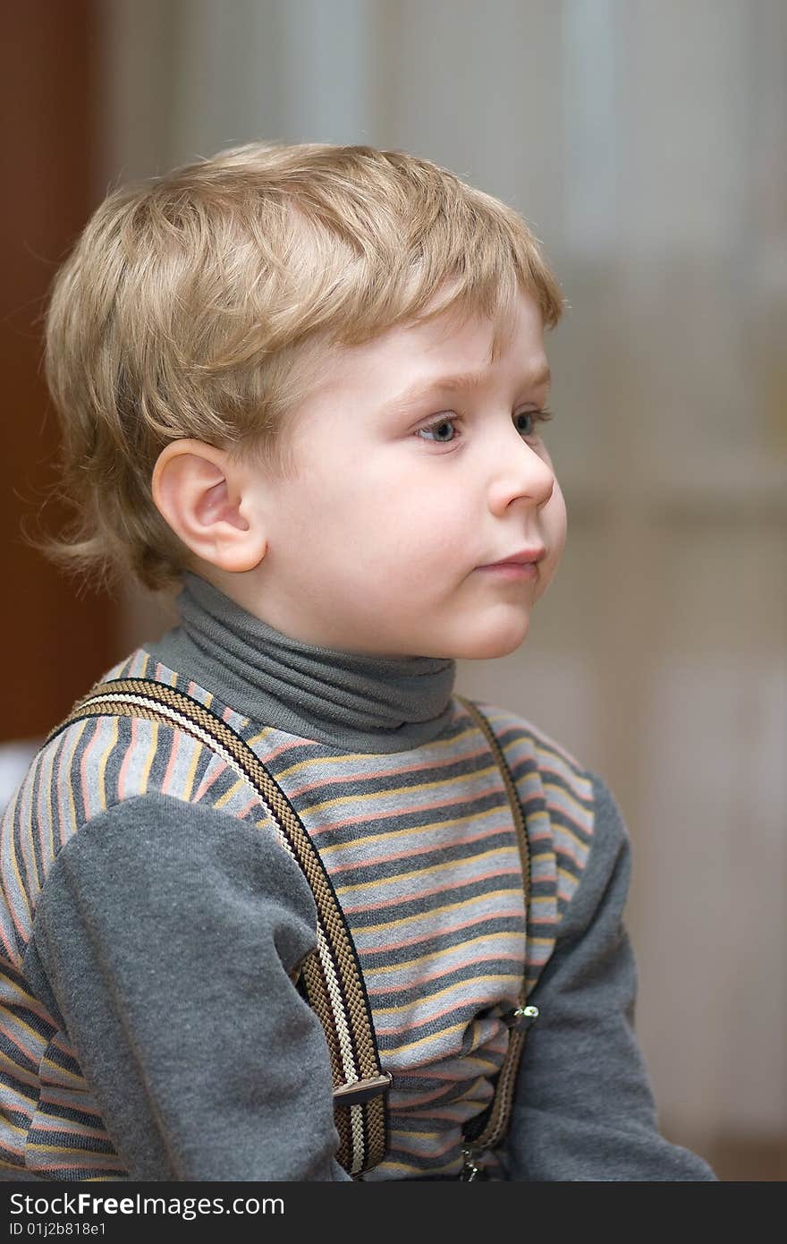 Cute little boy with blue eyes looking forward. Cute little boy with blue eyes looking forward