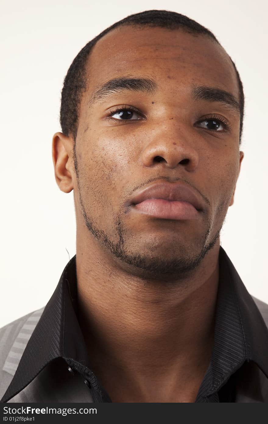 An african american man with look of determination on his face. An african american man with look of determination on his face.