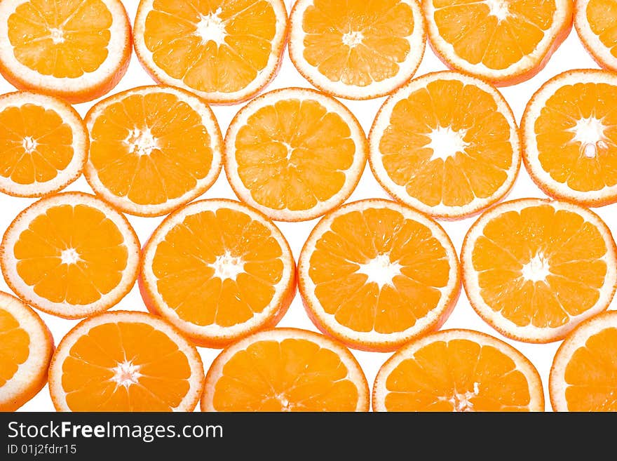 It is a lot of segments of oranges on a white background. It is a lot of segments of oranges on a white background