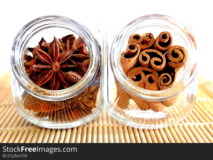 Cinnamon Stick and Anise Star in transparent container. Cinnamon Stick and Anise Star in transparent container