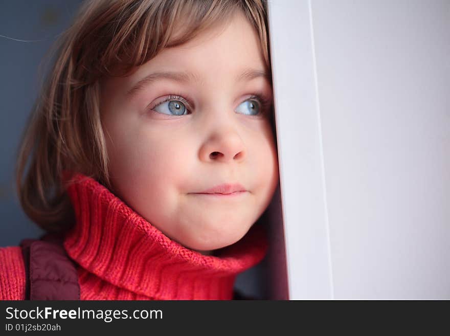 Portrait of little thoughtful girl