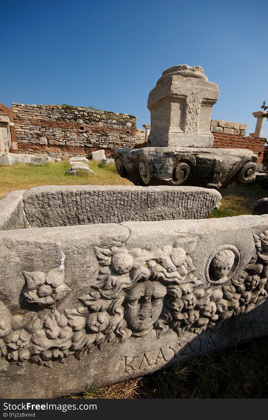 A carved limestone sarcophagus, featuring the head of a woman in the grounds of the Church of St John, Selcuk, Turkey. A carved limestone sarcophagus, featuring the head of a woman in the grounds of the Church of St John, Selcuk, Turkey