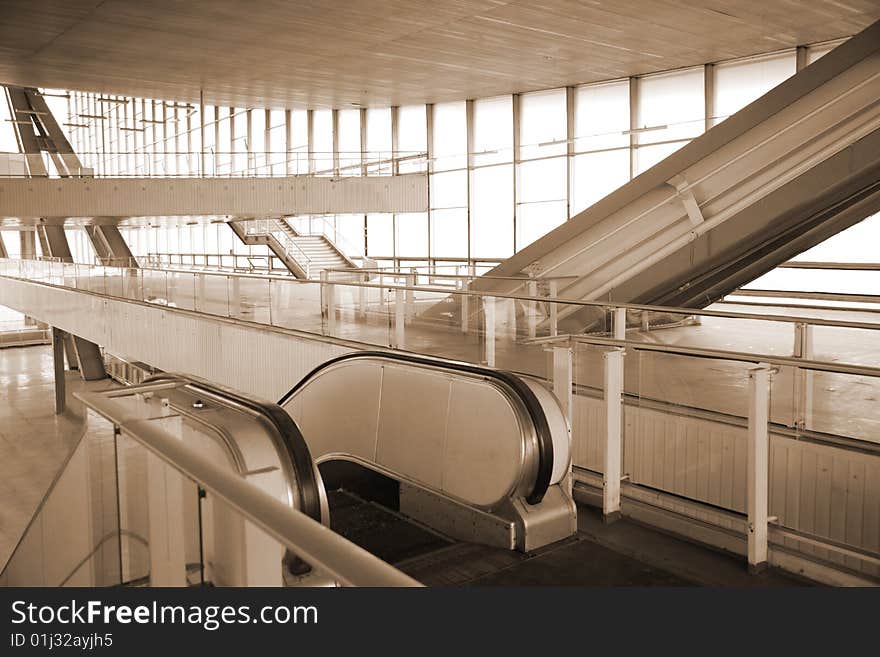 Escalators in glass hall