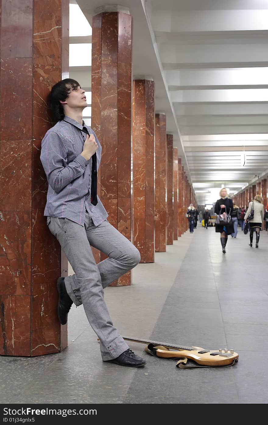 Young musician at metro station