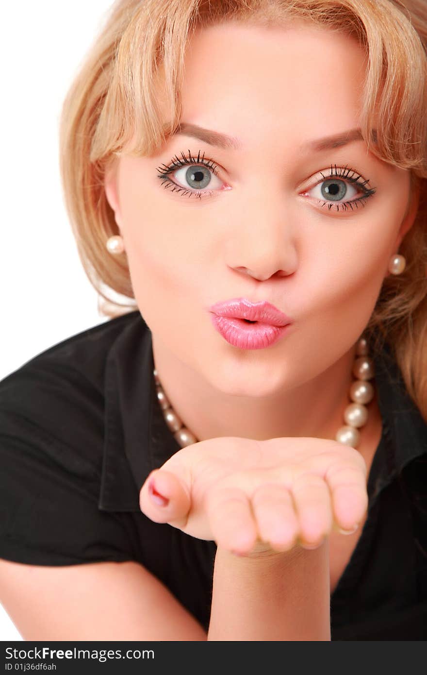 Blonde blows on palm, air kiss on white background