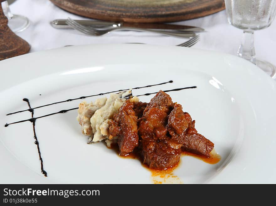 Delicious gourmet plate of meat and mashed potatoes