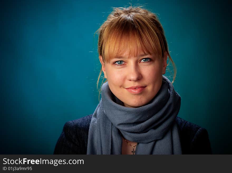 Portrait of female on a blue background in studio