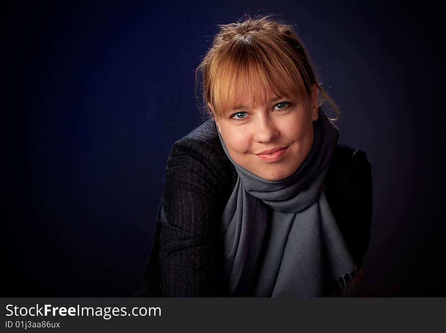 Portrait of female on a blue background in studio