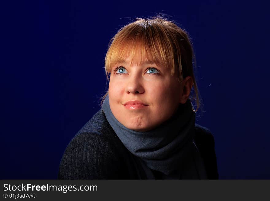 Portrait of female on a blue background in studio