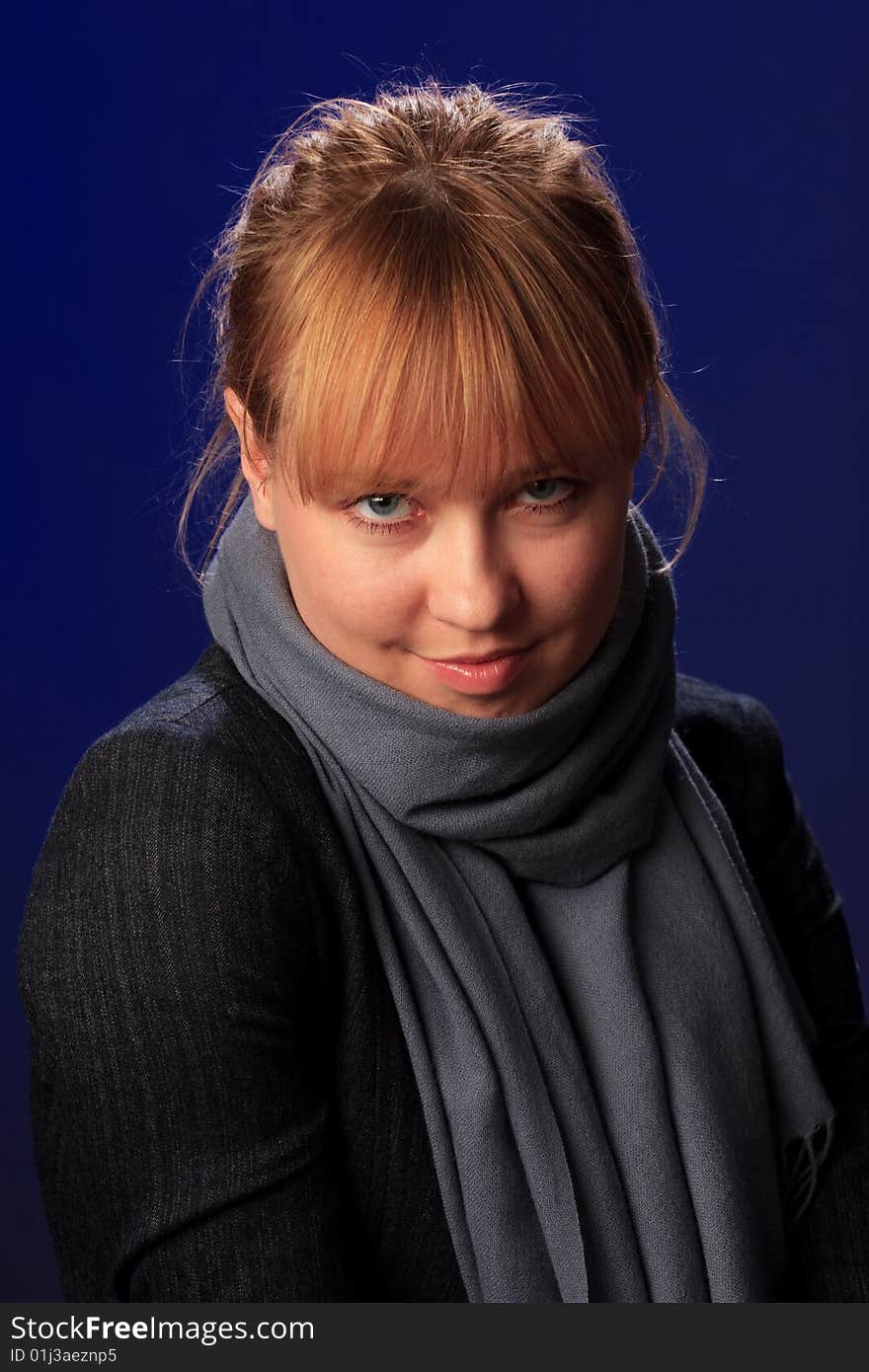 Portrait of female on a blue background in studio