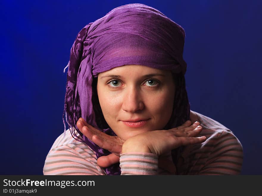 Portrait of female on a blue background in studio